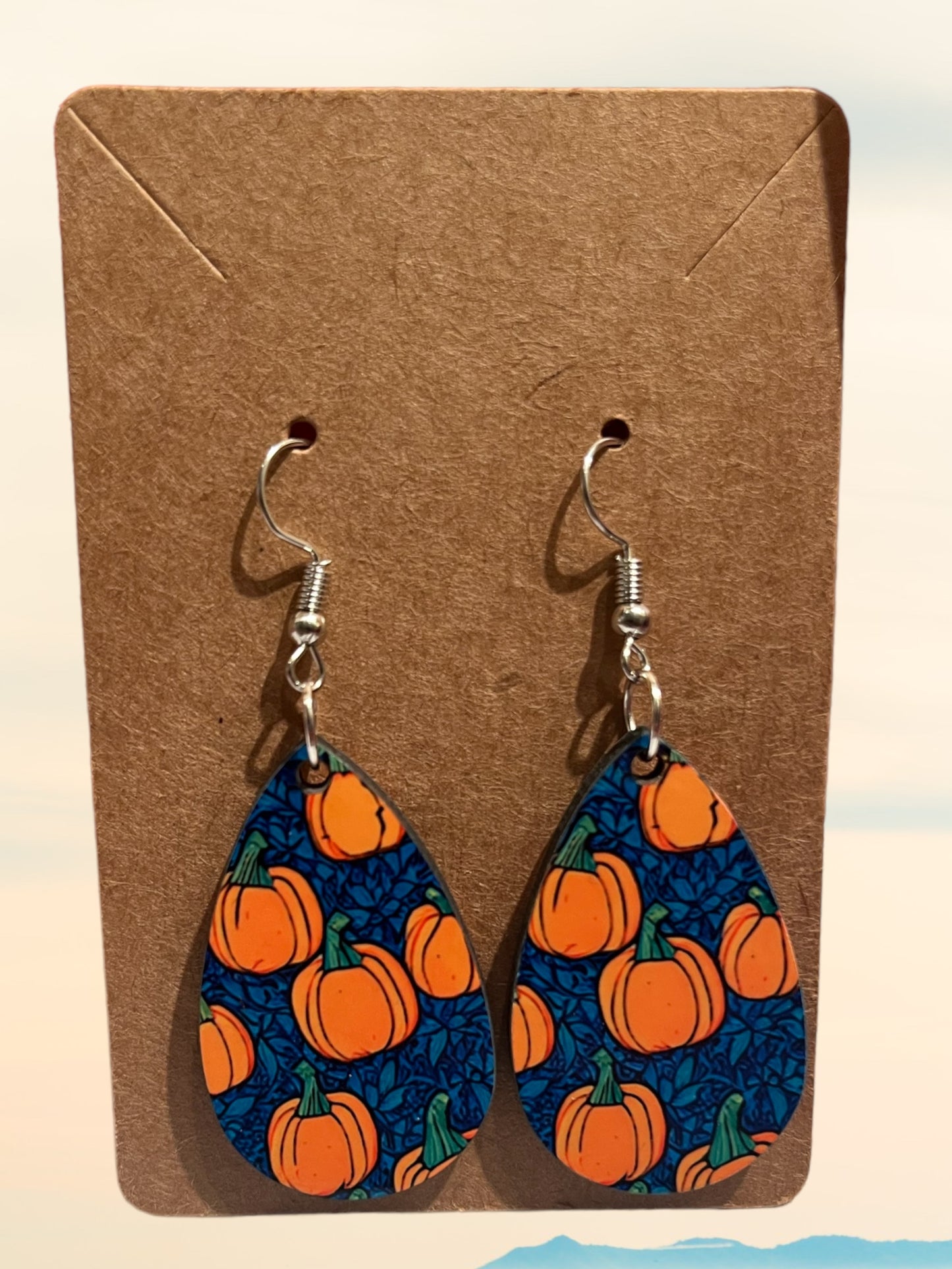 Pumpkins with blue background tear drop earrings