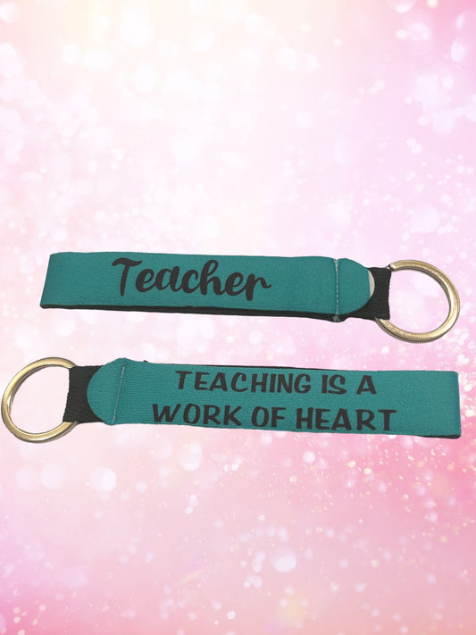 Teaching is a work of heart wristlet