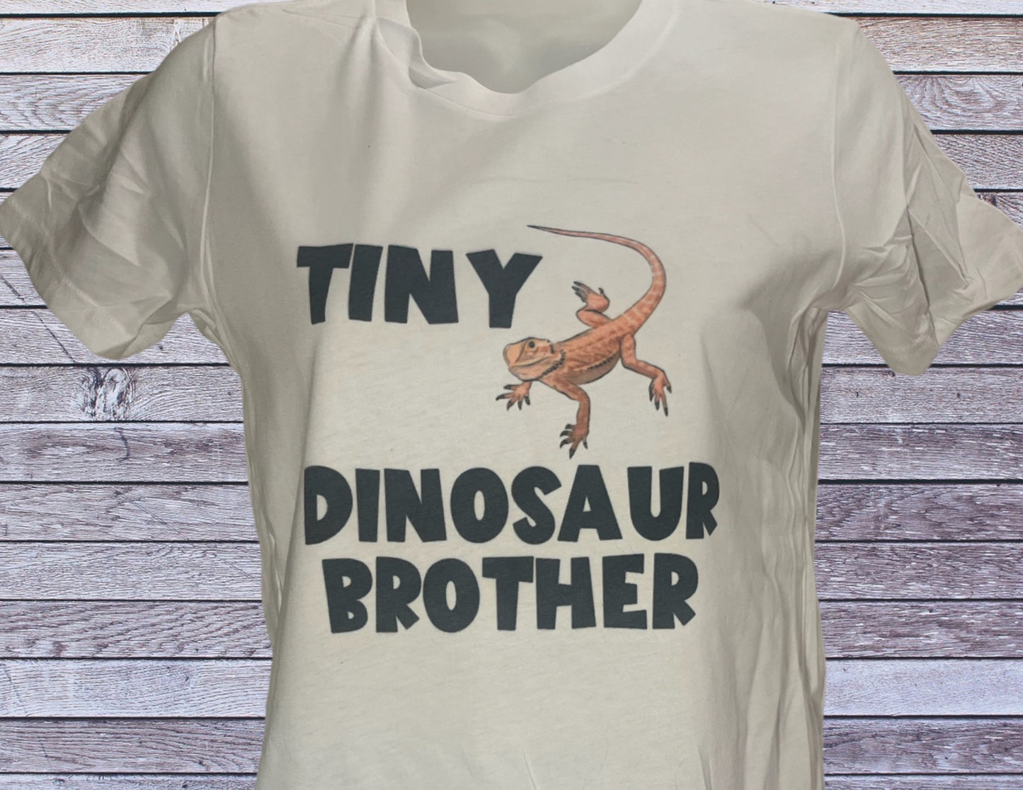 Tiny dinosaur brother